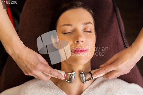 Image of woman having hydradermie facial treatment in spa