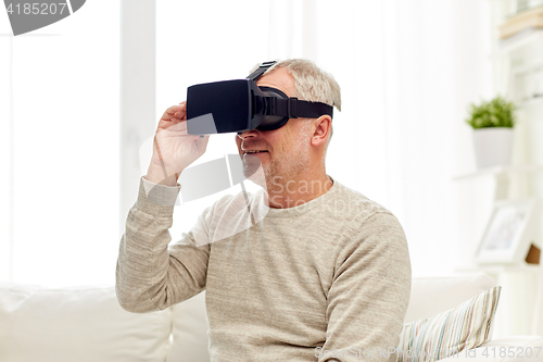 Image of old man in virtual reality headset or 3d glasses