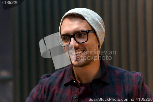 Image of happy smiling man in eyeglasses and hipster hat