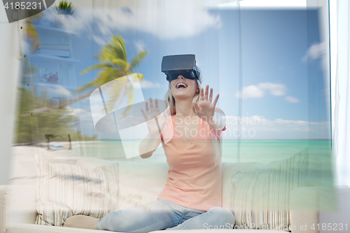 Image of woman with virtual reality headset over beach