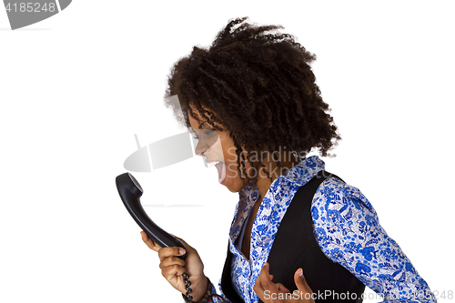 Image of Angry african american woman with handset