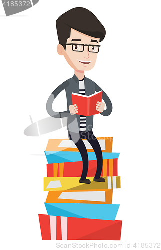 Image of Student sitting on huge pile of books.
