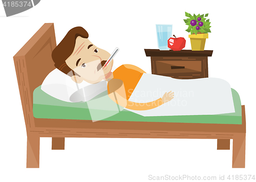 Image of Sick man with thermometer laying in bed.