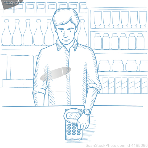 Image of Man paying wireless with smart watch.