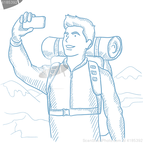Image of Man with backpack making selfie.