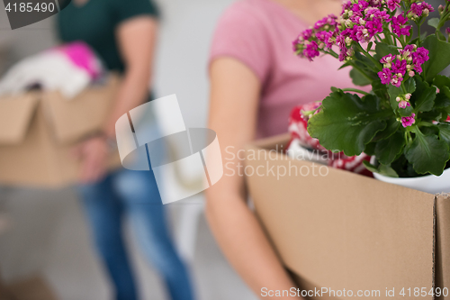 Image of young couple moving into a new home