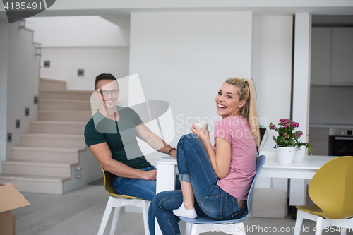 Image of Young couple moving in a new home