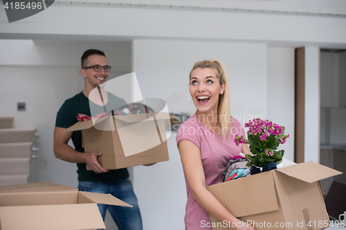 Image of young couple moving into a new home