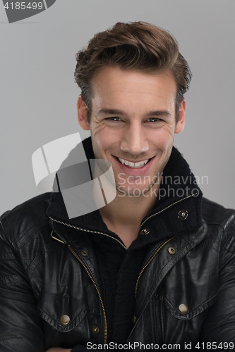 Image of portrait of a young guy over gray background