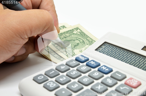 Image of Calculator, money and pen isolated on white