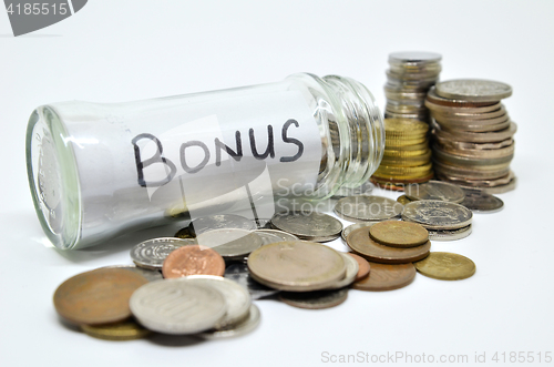 Image of Bonus lable in a glass jar with coins spilling out