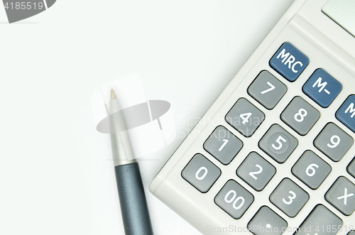 Image of Calculator and pen isolated on white