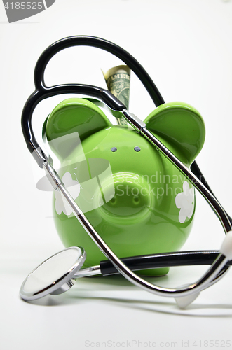 Image of Piggy bank and stethoscope