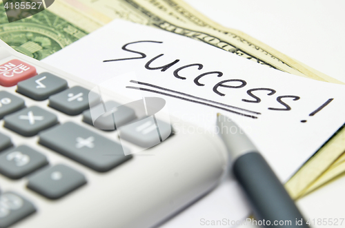 Image of Calculator, money and success word
