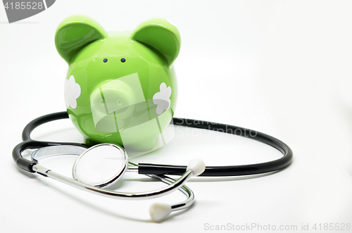 Image of Piggy bank and stethoscope
