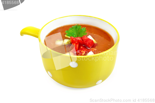 Image of Soup tomato with parsley in yellow bowl