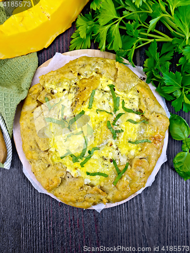 Image of Pie of pumpkin and cheese whole on board top