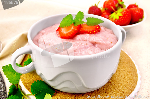 Image of Soup strawberry in bowl on granite table