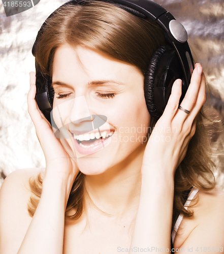 Image of young pretty woman in headphones listening music, singing a song happy smiling, lifestyle people concept