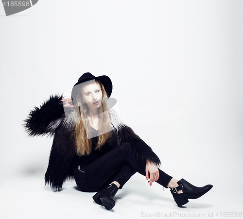 Image of young blonde teenage girl in hat and fur coat, fashion dressed m