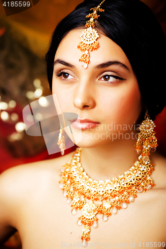 Image of beauty sweet real indian girl in sari smiling on black backgroun