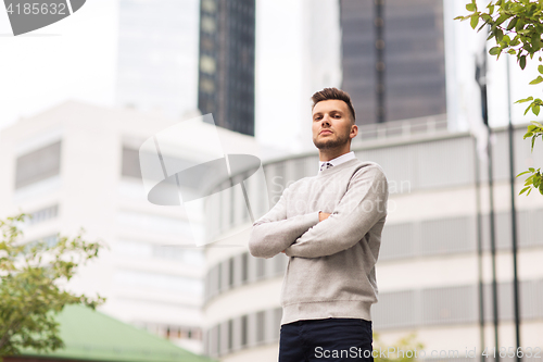 Image of young man on city street