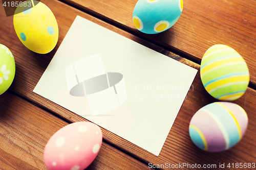 Image of close up of easter eggs and blank white paper