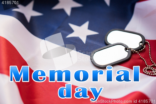 Image of memorial day words over american flag and dog tags