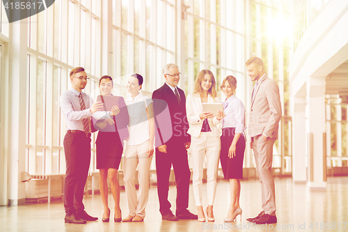 Image of business people with tablet pc computers at office