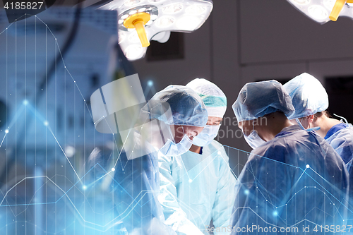 Image of group of surgeons in operating room at hospital