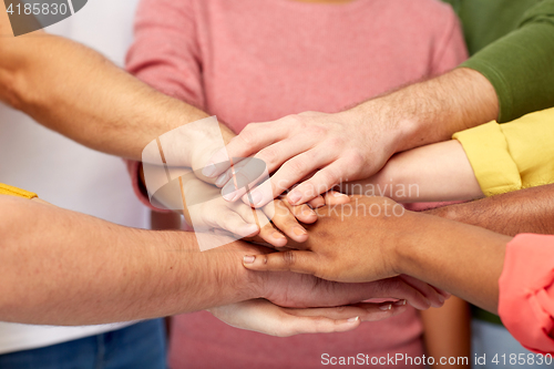 Image of group of international people with hands together