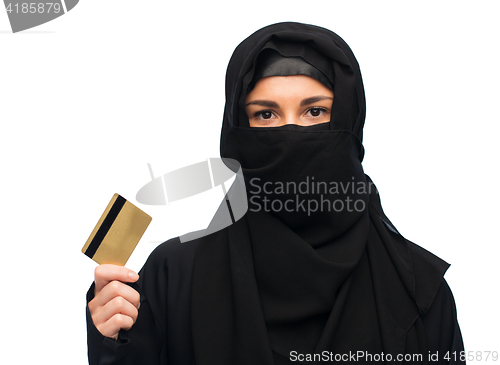 Image of muslim woman in hijab with credit card over white