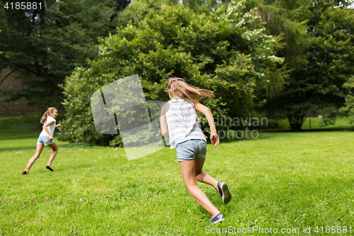 Image of happy kids or friends playing outdoors