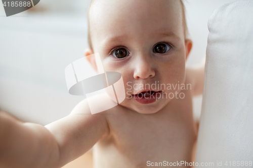 Image of close up of happy little baby boy or girl at home