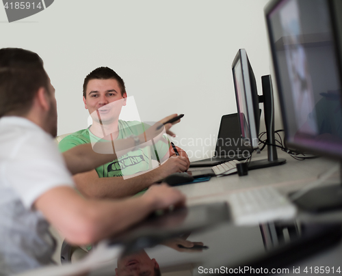 Image of a group of graphic designers at work