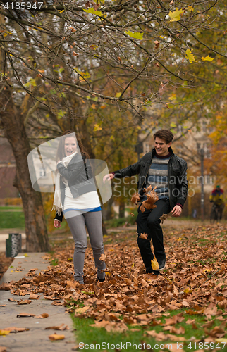 Image of Happy young Couple in Autumn Park