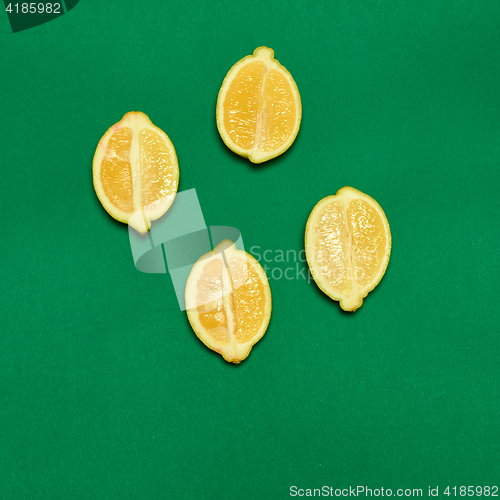 Image of Lemons on green background