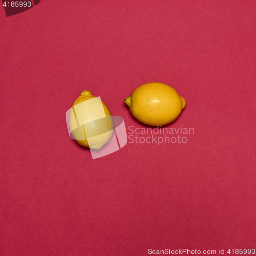 Image of Lemons on red background