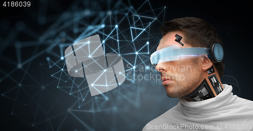 Image of man with futuristic glasses and sensors