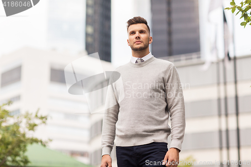 Image of young man on city street