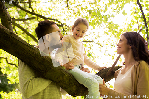 Image of happy family in summer park having fun