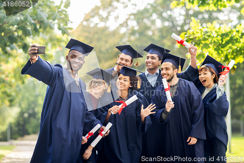 Image of students or bachelors taking selfie by smartphone