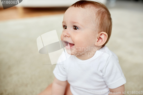 Image of close up of happy little baby boy or girl at home