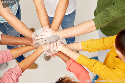 Image of group of international people with hands together