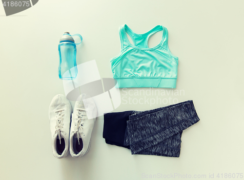 Image of close up of female sports clothing and bottle set