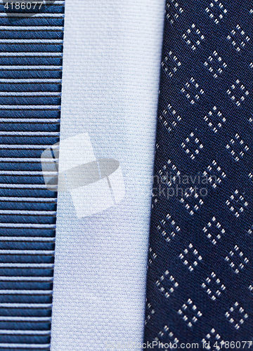 Image of close up of blue patterned ties