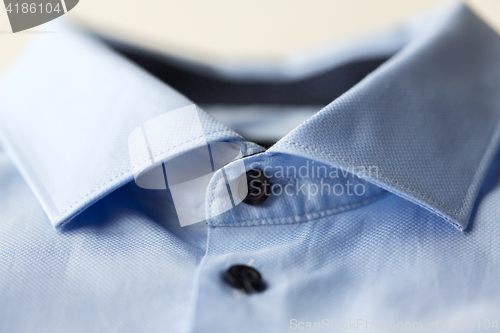 Image of close up of blue shirt collar