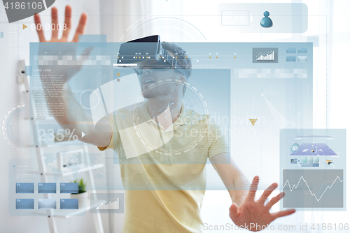 Image of young man in virtual reality headset or 3d glasses