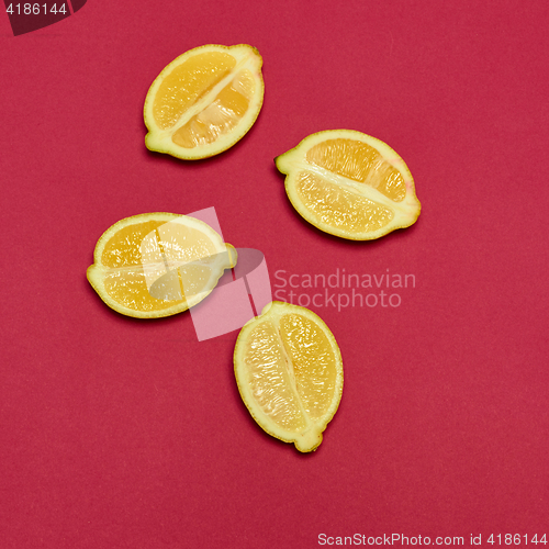 Image of Lemons on red background