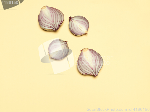 Image of Red onion on a yellow background